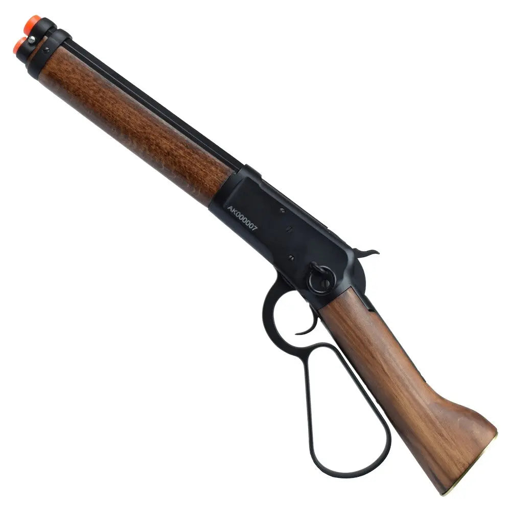 Balise alt SEO : "Carabine à gaz A&K Winchester M1873 noire, corps et canon en métal, crosse en bois, levier d'action métal, chargeur 25 coups, chambre à gaz, hop up régl
